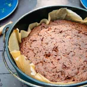 Side view of banana bread in a cast iron dutch oven.